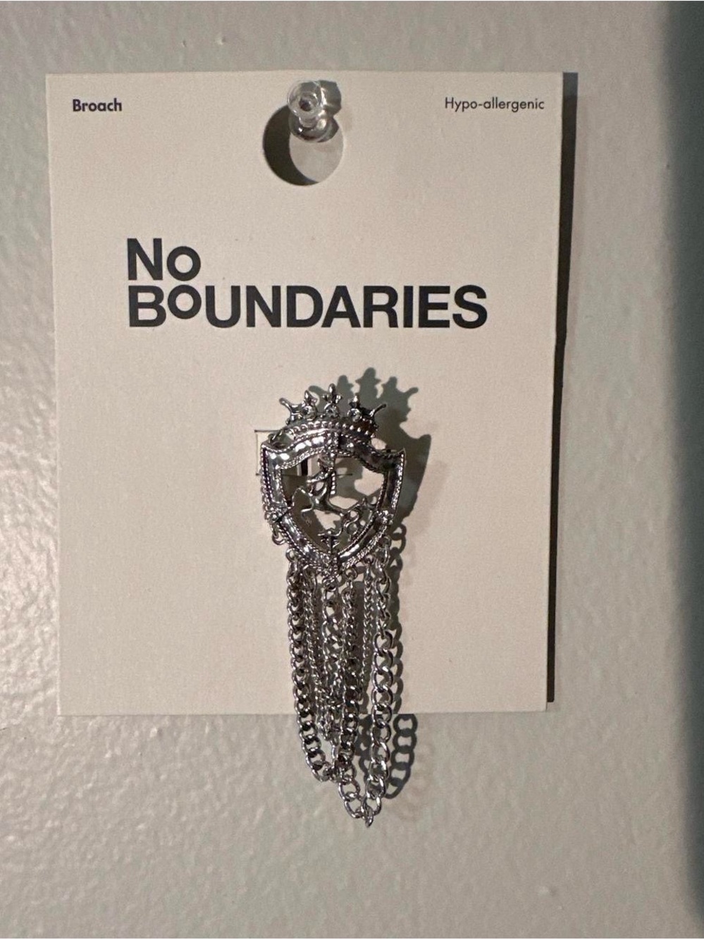 No Boundaries Silver Tone Shield Brooch with Chain Tassels